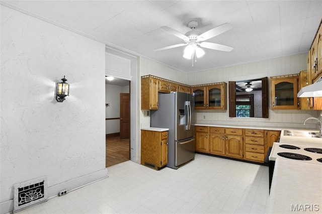 503 E State St, Union, MO 63084 - kitchen with stainless steel fridge with ice dispenser, brown cabinetry, a ceiling fan, light countertops, and crown molding