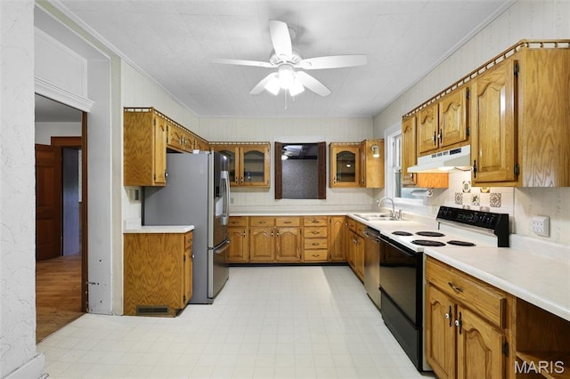 503 E State St, Union, MO 63084 - kitchen with appliances with stainless steel finishes, under cabinet range hood, a ceiling fan, brown cabinets, and light countertops