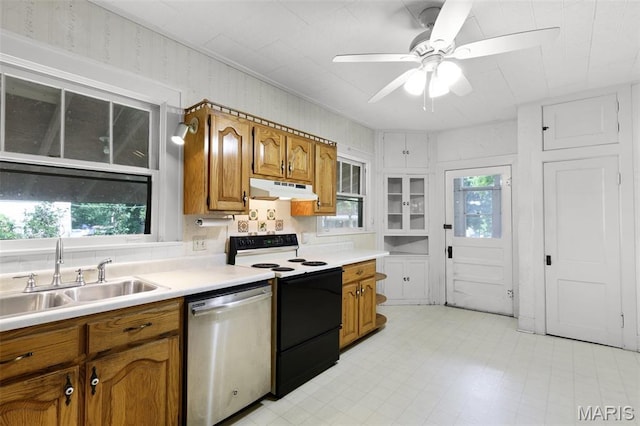 503 E State St, Union, MO 63084 - kitchen featuring dishwasher, electric range, under cabinet range hood, brown cabinetry, and light countertops