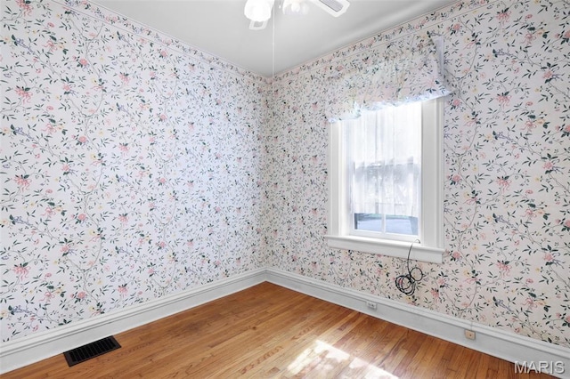 503 E State St, Union, MO 63084 - spare room featuring light wood finished floors, wallpapered walls, and a ceiling fan