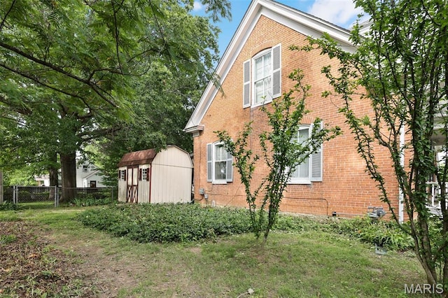 503 E State St, Union, MO 63084 - view of home's exterior featuring brick siding and a storage shed