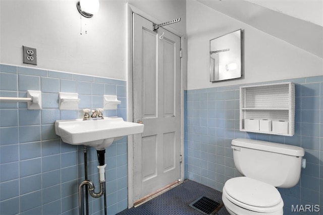 503 E State St, Union, MO 63084 - bathroom with tile walls, wainscoting, and tile patterned floors