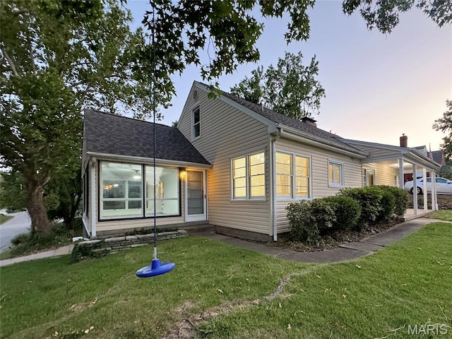 1001 Pike St, Saint Charles, MO 63301 - view of front of house featuring a yard, a chimney, and a shingled roof