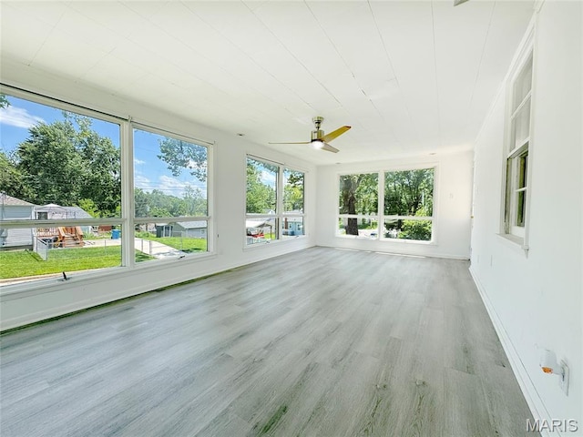 1001 Pike St, Saint Charles, MO 63301 - unfurnished sunroom with healthy amount of natural light and wood finished floors