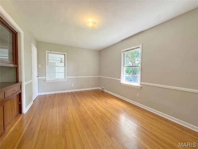 1001 Pike St, Saint Charles, MO 63301 - empty room featuring light wood-type flooring and baseboards