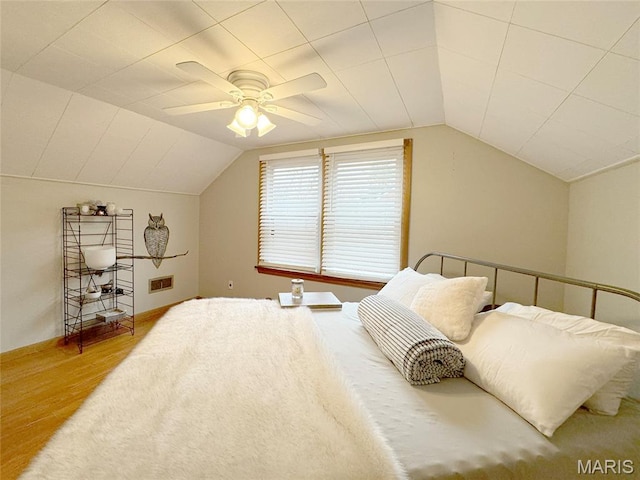 1001 Pike St, Saint Charles, MO 63301 - bedroom featuring wood finished floors, vaulted ceiling, and a ceiling fan