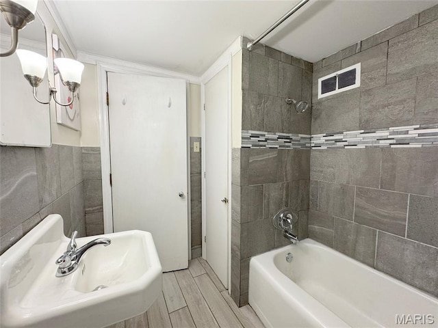 1001 Pike St, Saint Charles, MO 63301 - full bath with tub / shower combination and wood finished floors