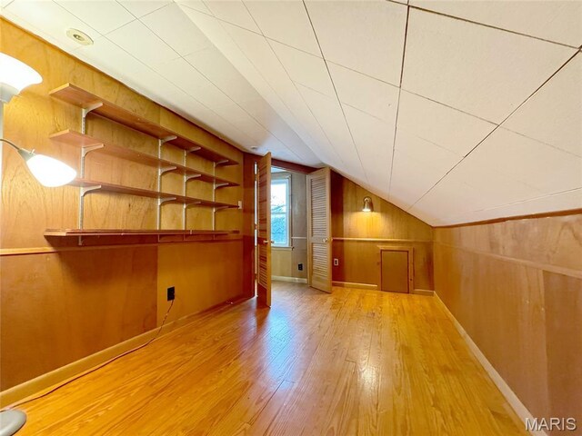 1001 Pike St, Saint Charles, MO 63301 - bonus room with hardwood / wood-style floors, lofted ceiling, and wood walls