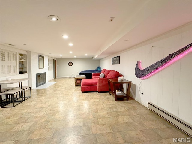 1001 Pike St, Saint Charles, MO 63301 - living room featuring a baseboard heating unit, recessed lighting, a brick fireplace, built in features, and light stone finish floors