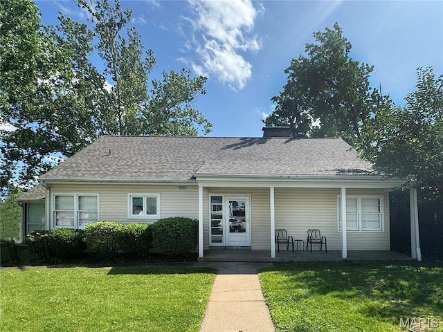 1001 Pike St, Saint Charles, MO 63301 - view of front of house with a porch, a front lawn, roof with shingles, and a chimney