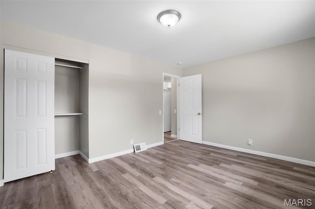 1715 Hudson Rd, Dellwood, MO 63136 - unfurnished bedroom featuring wood finished floors and a closet