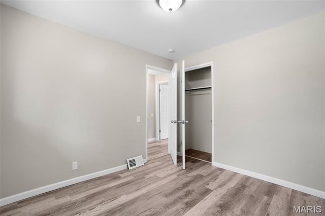 1715 Hudson Rd, Dellwood, MO 63136 - unfurnished bedroom featuring wood finished floors and a closet
