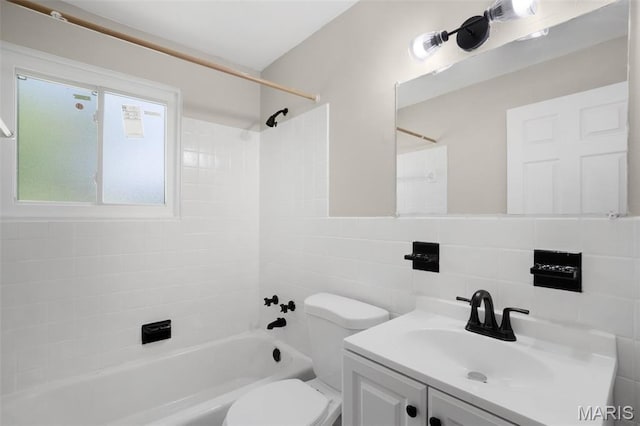 1715 Hudson Rd, Dellwood, MO 63136 - bathroom with tile walls, bathing tub / shower combination, and vanity