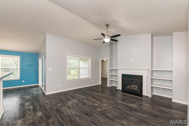 17458 Wyman Ridge Dr, Eureka, MO 63025 - unfurnished living room featuring vaulted ceiling, healthy amount of natural light, dark wood-style floors, and a ceiling fan