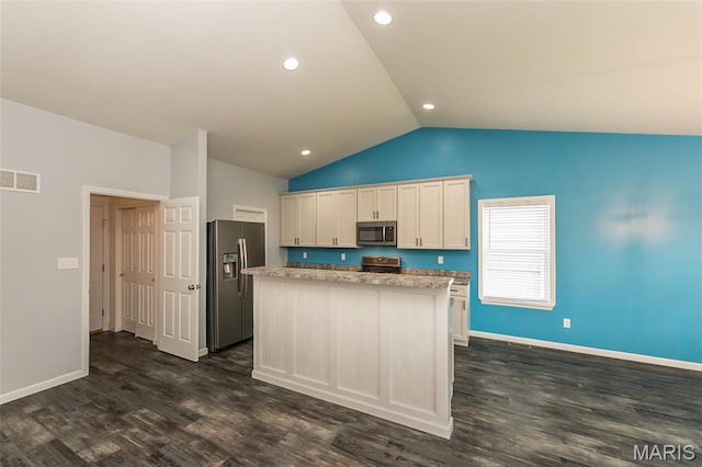 17458 Wyman Ridge Dr, Eureka, MO 63025 - kitchen with stainless steel appliances, a kitchen island, lofted ceiling, dark wood finished floors, and recessed lighting