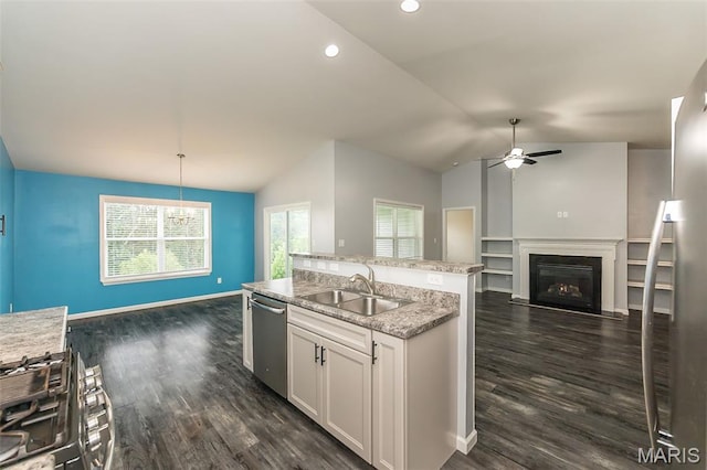 17458 Wyman Ridge Dr, Eureka, MO 63025 - kitchen featuring appliances with stainless steel finishes, open floor plan, vaulted ceiling, a ceiling fan, and a glass covered fireplace