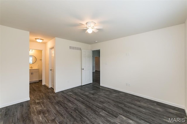 17458 Wyman Ridge Dr, Eureka, MO 63025 - unfurnished bedroom with dark wood-style flooring, ensuite bathroom, and a ceiling fan