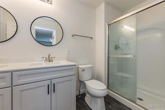 17458 Wyman Ridge Dr, Eureka, MO 63025 - bathroom with double vanity, wood finished floors, and a shower stall