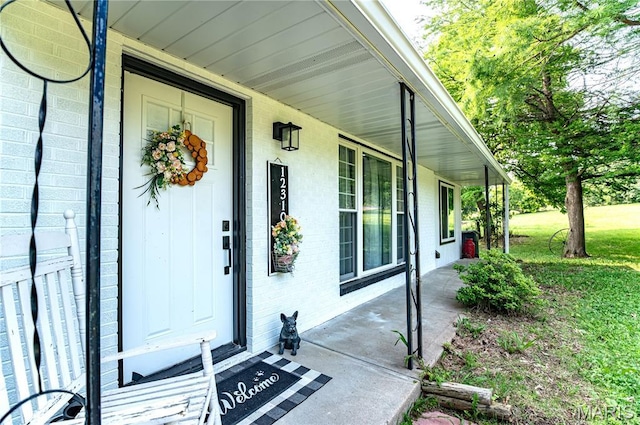 12310 State Route Hh, Rolla, MO 65401 - doorway to property with brick siding and covered porch