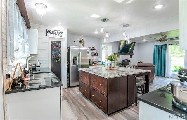 12310 State Route Hh, Rolla, MO 65401 - kitchen with stainless steel fridge, a sink, dark brown cabinets, light wood-style flooring, and recessed lighting