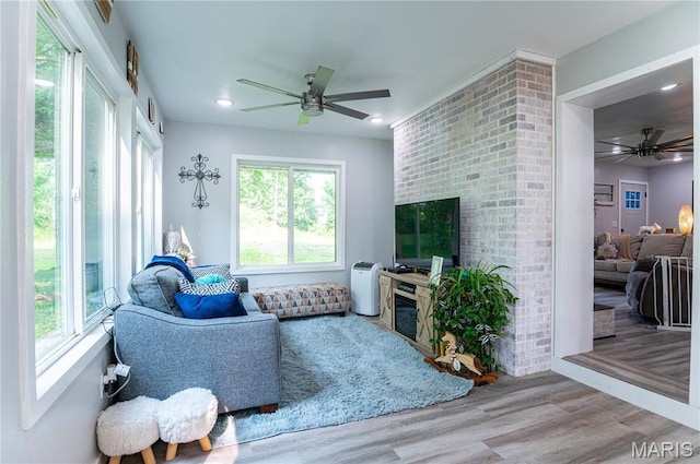 12310 State Route Hh, Rolla, MO 65401 - living room featuring a fireplace, a ceiling fan, wood finished floors, and recessed lighting
