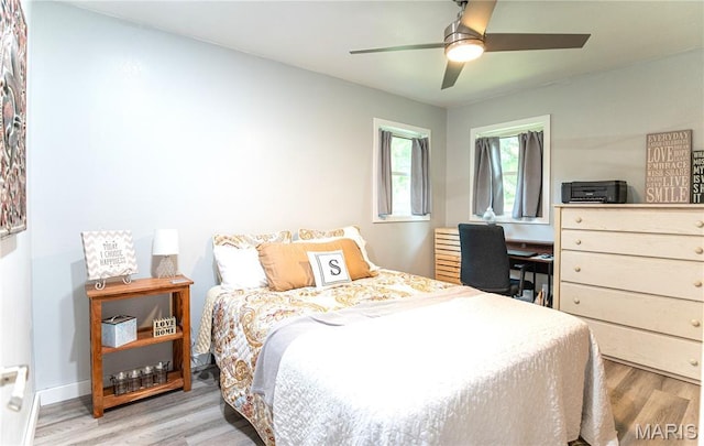 12310 State Route Hh, Rolla, MO 65401 - bedroom with wood finished floors and ceiling fan