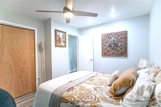 12310 State Route Hh, Rolla, MO 65401 - bedroom with light wood finished floors, a ceiling fan, a closet, and recessed lighting