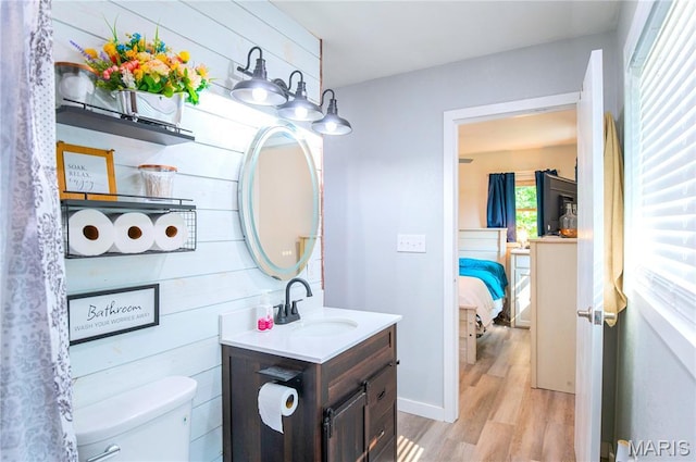 12310 State Route Hh, Rolla, MO 65401 - bathroom featuring wood finished floors, vanity, toilet, and ensuite bathroom