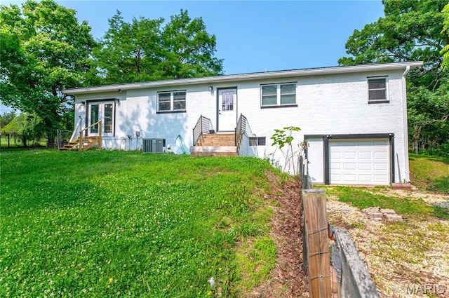 12310 State Route Hh, Rolla, MO 65401 - view of front of house featuring a garage, central air condition unit, brick siding, a front yard, and driveway