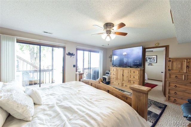 1527 Resorts Rd, Camdenton, MO 65020 - bedroom with access to outside, a textured ceiling, light colored carpet, and ceiling fan