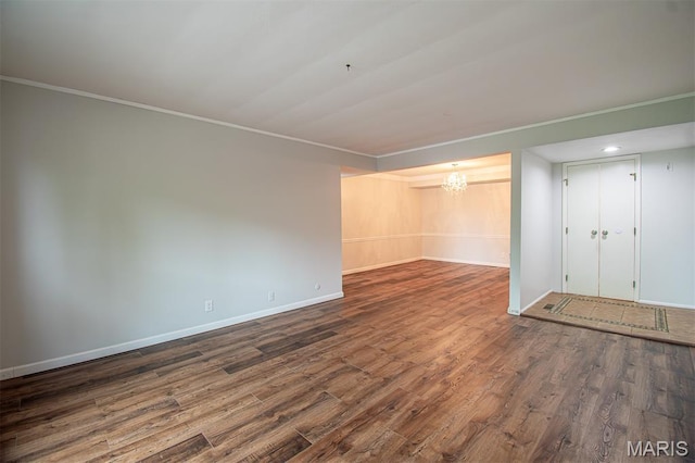 10344 Forest Brook Ln Unit C, Saint Louis, MO 63146 - unfurnished living room with wood finished floors, a chandelier, and ornamental molding