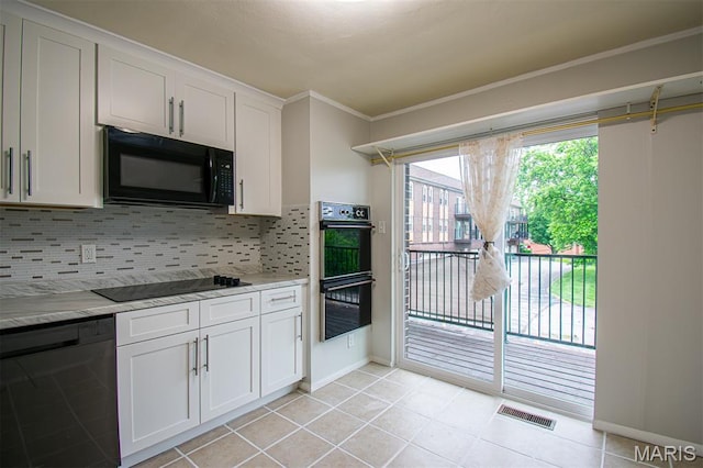 10344 Forest Brook Ln Unit C, Saint Louis, MO 63146 - kitchen featuring black appliances, light countertops, backsplash, white cabinetry, and crown molding