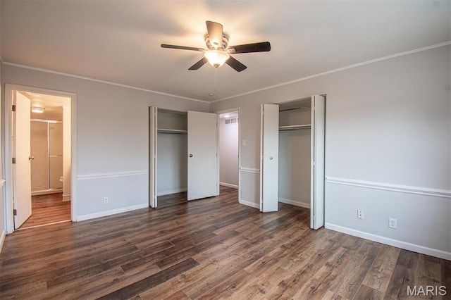 10344 Forest Brook Ln Unit C, Saint Louis, MO 63146 - unfurnished bedroom featuring two closets, crown molding, dark wood finished floors, and ceiling fan