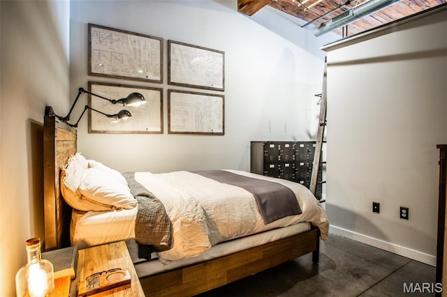 721 17th St Unit 207, Saint Louis, MO 63102 - bedroom featuring baseboards and concrete floors