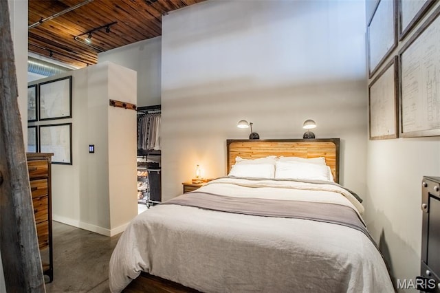 721 17th St Unit 207, Saint Louis, MO 63102 - bedroom featuring track lighting and wooden ceiling