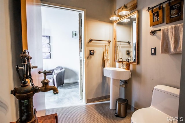 721 17th St Unit 207, Saint Louis, MO 63102 - half bathroom with toilet and baseboards