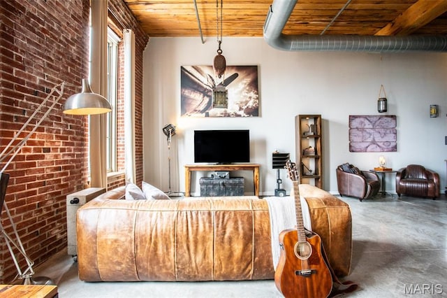 721 17th St Unit 207, Saint Louis, MO 63102 - living room with wood ceiling, brick wall, and concrete flooring