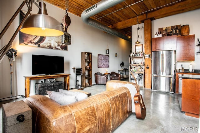 721 17th St Unit 207, Saint Louis, MO 63102 - living area featuring a wooden ceiling with exposed beams, a dry bar, and concrete flooring
