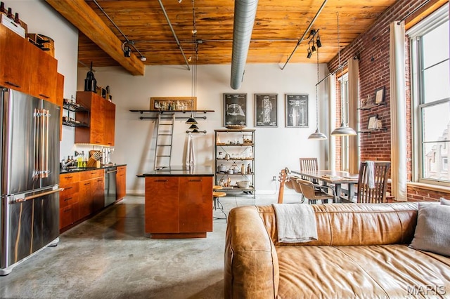 721 17th St Unit 207, Saint Louis, MO 63102 - kitchen featuring high end fridge, a wood ceiling with exposed beams, brick wall, dishwasher, and dark countertops