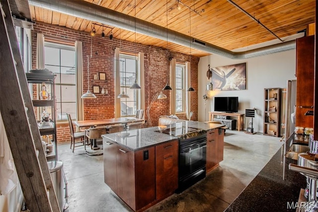 721 17th St Unit 207, Saint Louis, MO 63102 - kitchen with electric range, wooden ceiling, finished concrete flooring, brick wall, and dark stone counters