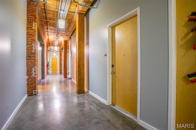 721 17th St Unit 207, Saint Louis, MO 63102 - hall featuring baseboards and concrete flooring