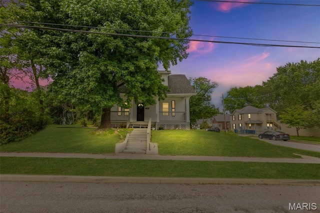 1801 Main St, Alton, IL 62002 - obstructed view of property with a porch and a lawn