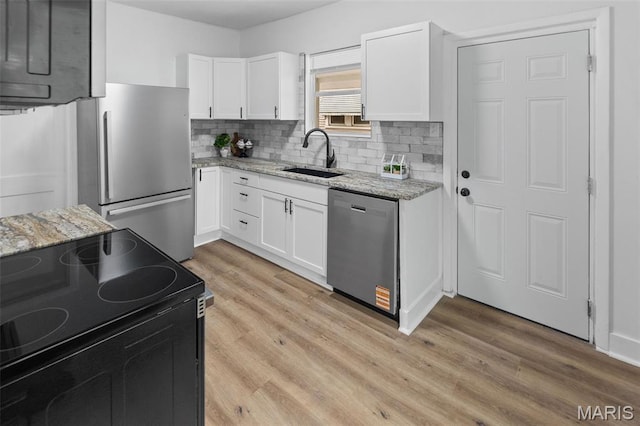 1801 Main St, Alton, IL 62002 - kitchen with appliances with stainless steel finishes, white cabinets, and light stone counters