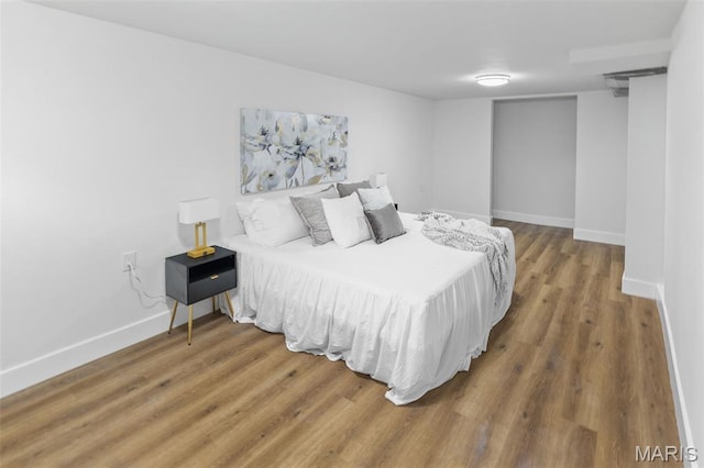 1801 Main St, Alton, IL 62002 - bedroom featuring wood finished floors and baseboards