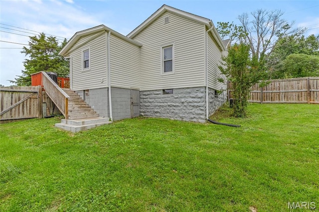 302 Bogy St, De Soto, MO 63020 - back of house featuring stairway