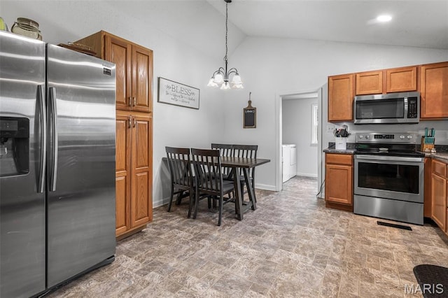 302 Bogy St, De Soto, MO 63020 - kitchen with appliances with stainless steel finishes, a chandelier, brown cabinets, vaulted ceiling, and stone finish flooring