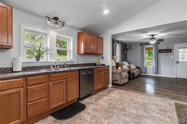 302 Bogy St, De Soto, MO 63020 - kitchen with dishwasher, plenty of natural light, brown cabinets, and lofted ceiling