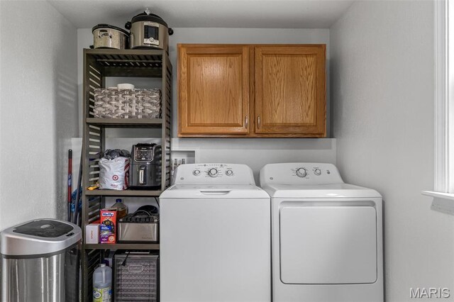 302 Bogy St, De Soto, MO 63020 - laundry area with cabinet space and washing machine and dryer