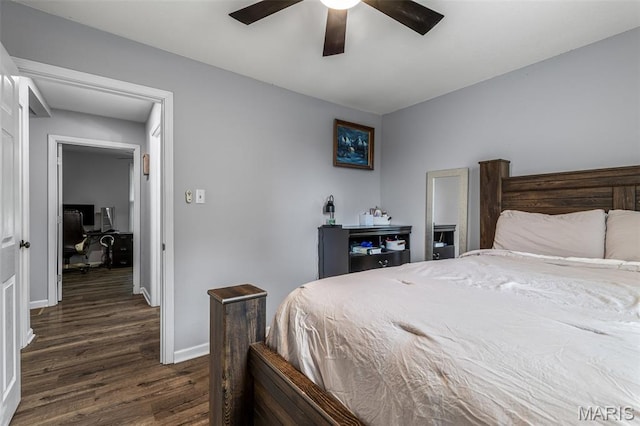 302 Bogy St, De Soto, MO 63020 - bedroom featuring dark wood-type flooring, an office area, and ceiling fan