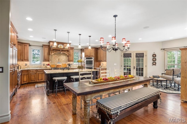 701 Crown Pointe Farms, Defiance, MO 63341 - dining space with wood finished floors, recessed lighting, and a chandelier
